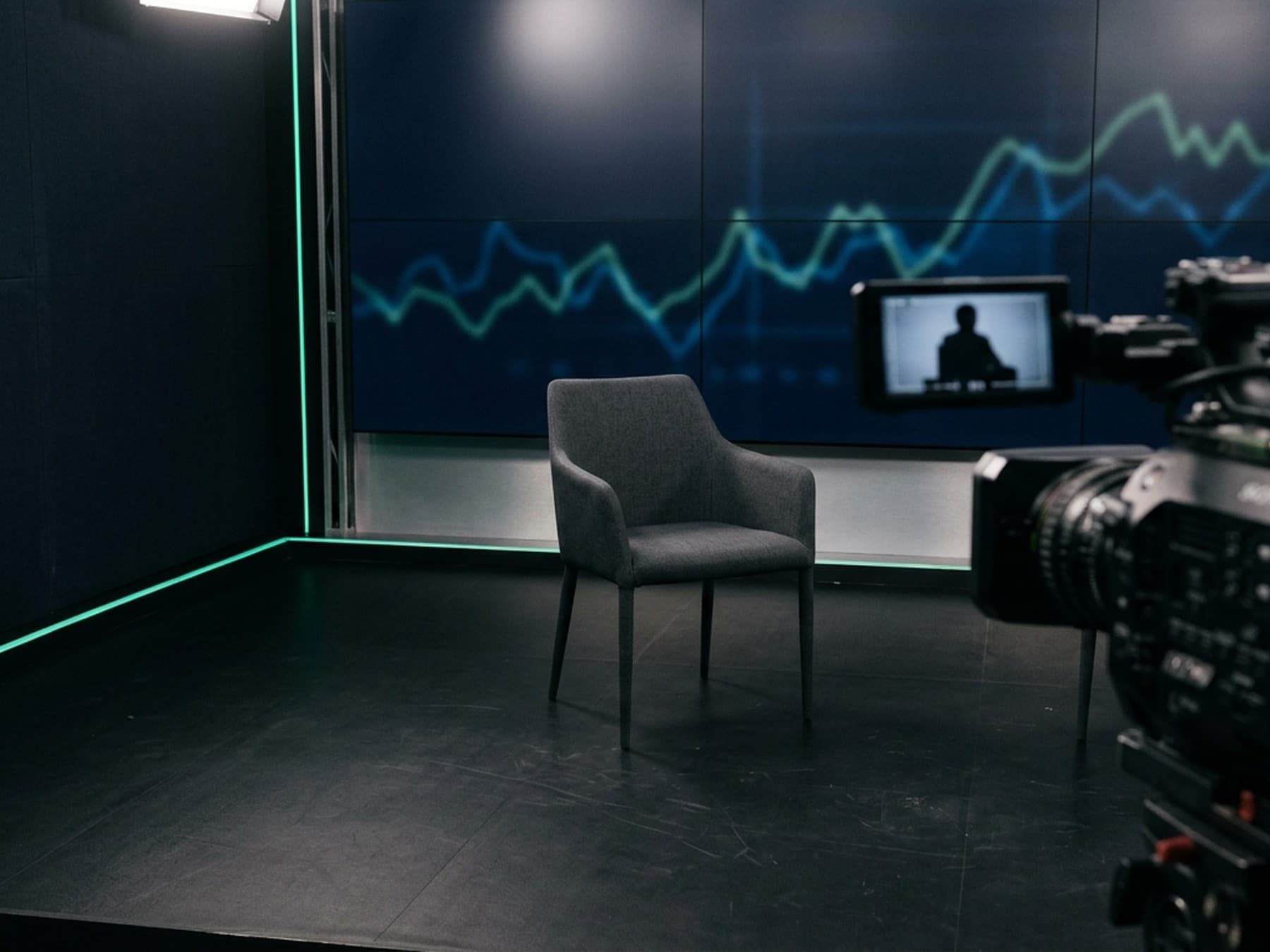 Video interview in progress, with a camera framing a speaker seated at a desk